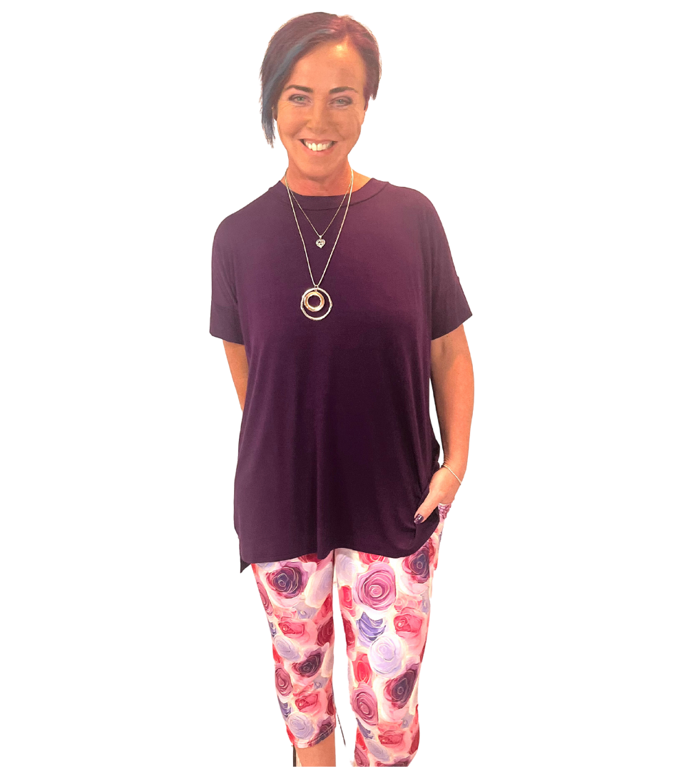 WOMAN WEARING PINK AND WHITE CAPRIS