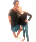 MOM AND DAUGHTER WEARING MATCHING LEGGINGS