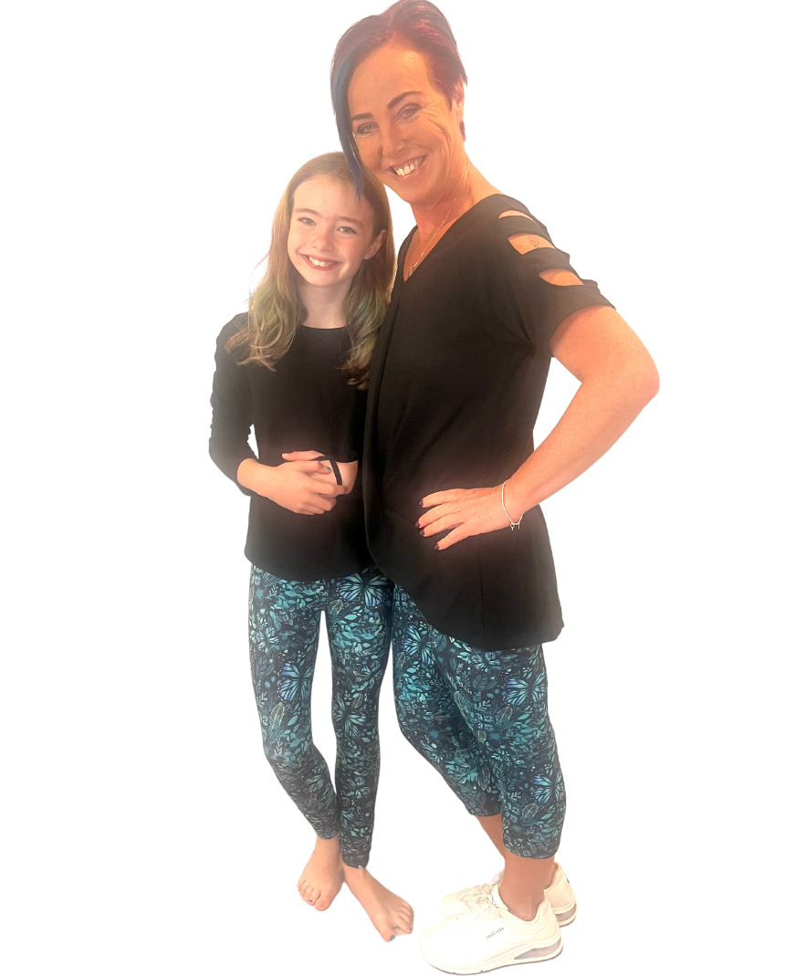 MOM AND DAUGHTER WEARING MATCHING LEGGINGS