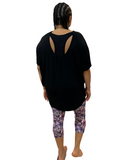 WOMAN WEARING PLUS SIZE OPEN BACK SHIRT