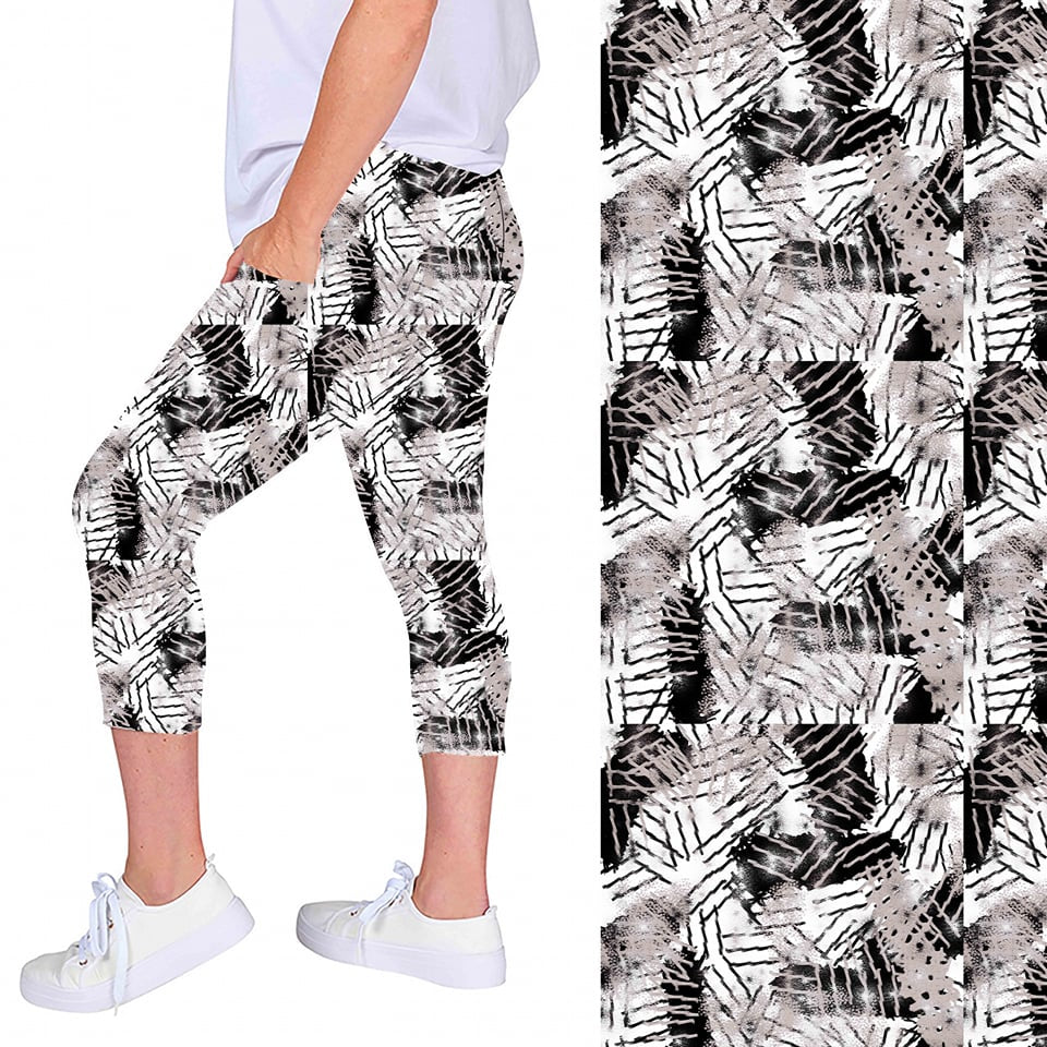 WOMAN WEARING CURVY BLACK AND WHITE LEGGING CAPRIS