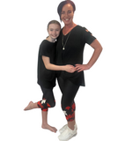 MOM AND DAUGHTER WEARING MATCHING CANADA DAY LEGGINGS