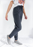 WOMAN WEARING PLUS SIZE CHARCOAL JOGGING PANTS