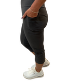 WOMAN WEARING CURVY CHARCOAL CAPRIS WITH POCKETS