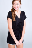 WOMAN WEARING A SHORT SLEEVE V-NECK BLACK SHIRT