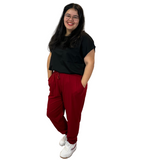 WOMAN WEARING PLUS SIZE BURGUNDY JOGGERS