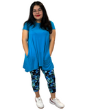 WOMAN WEARING EXTRA PLUS BLUE FLORAL CAPRIS