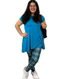 WOMAN WEARING EXTRA PLUS TEAL PLAID LEGGINGS