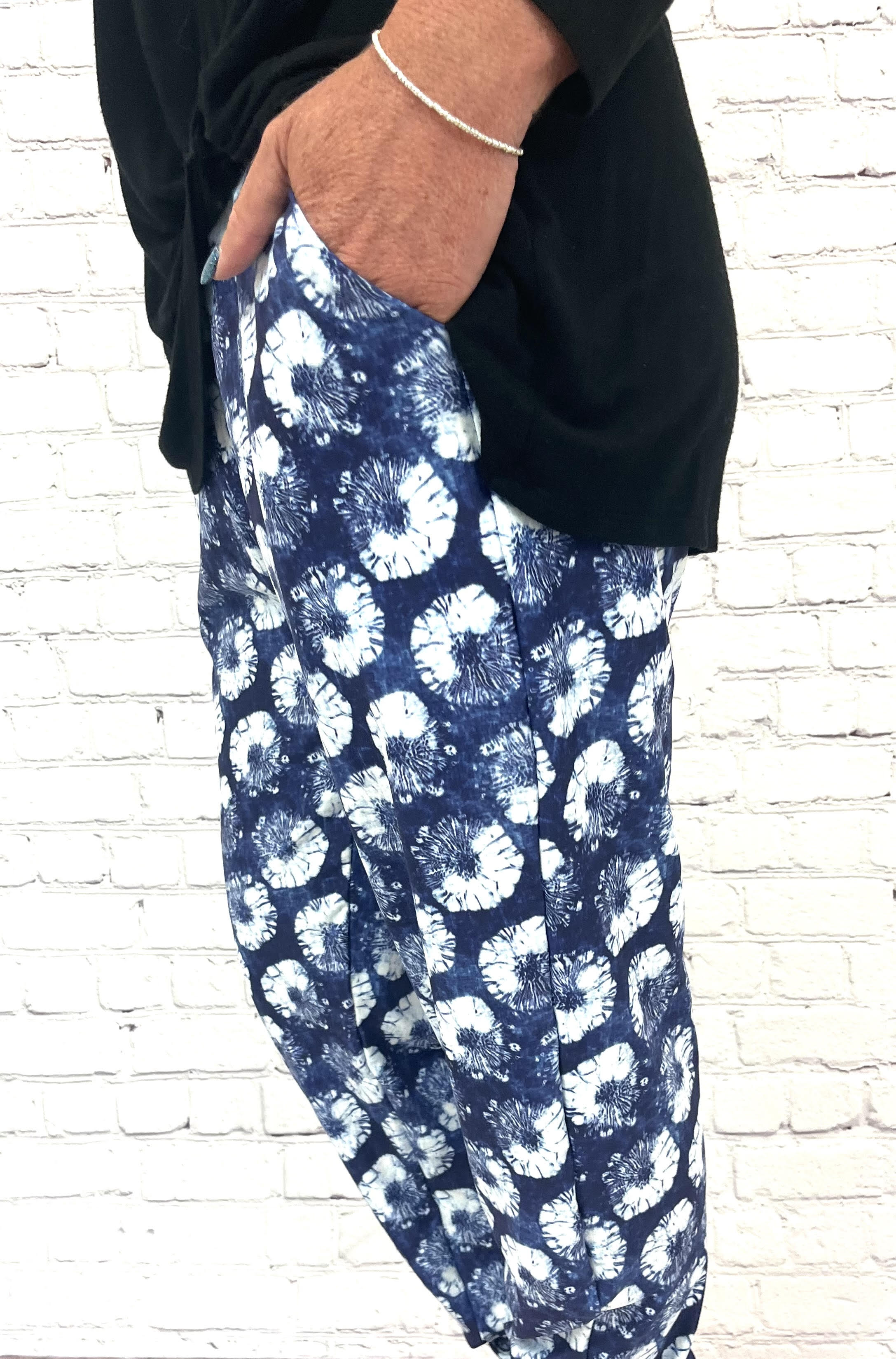 Woman wearing navy and white joggers