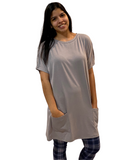 WOMAN WEARING GRAY T-SHIRT DRESS WITH LEGGINGS