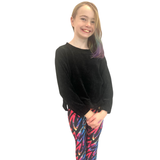 GIRL WEARING COLOURFUL LEGGINGS