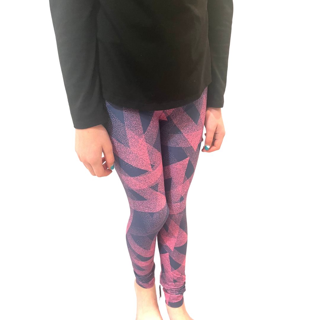 TWEEN WEARING PINK PLAID LEGGINGS