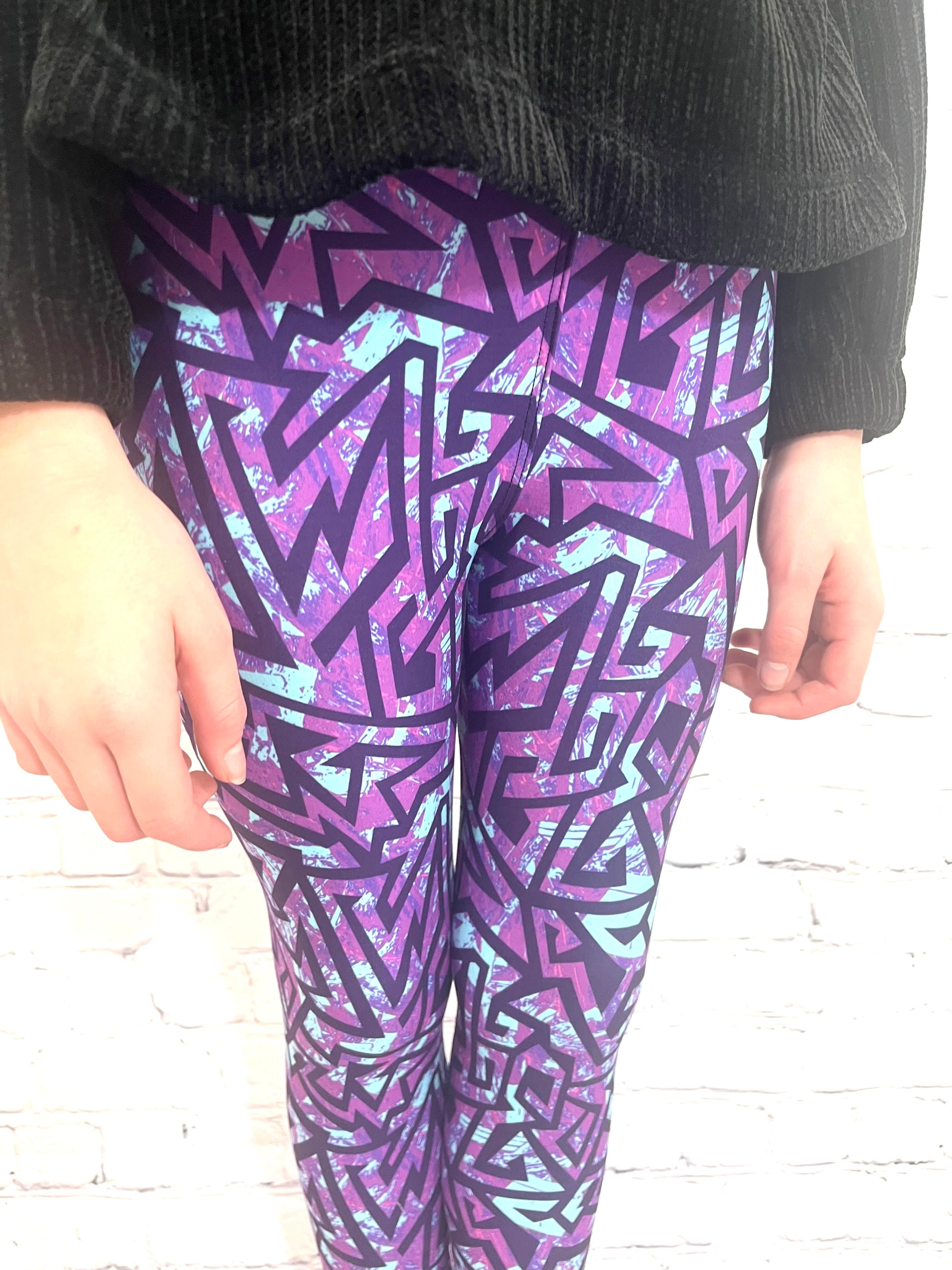 Toddler wearing purple galaxy leggings