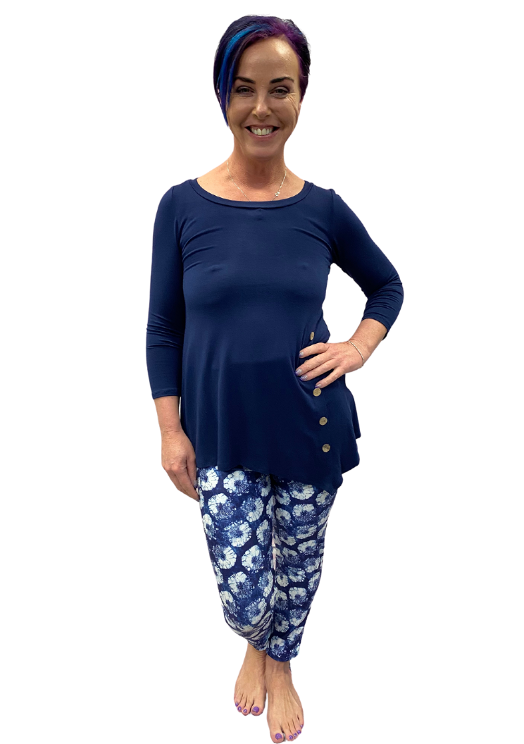 Woman wearing navy shirt and leggings