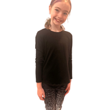 TWEEN WEARING BLACK AND WHITE LEGGINGS