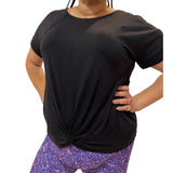 WOMAN WEARING PLUS SIZE BLACK SHORT SLEEVE SHIRT