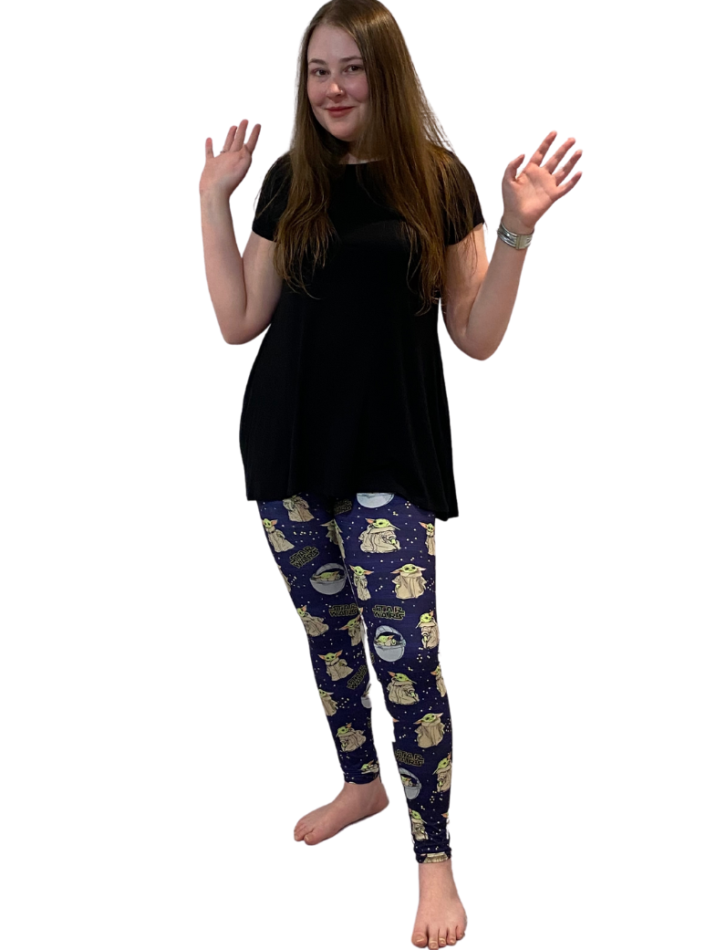 WOMAN WEARING EXTRA PLUS YODA LEGGINGS