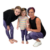 FAMILY WEARING MATCHING LEGGINGS