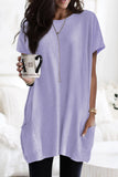 WOMAN WEARING OVERSIZED PURPLE TUNIC WITH POCKETS