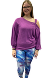 Woman wearing purple sweater and leggings