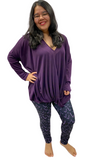 Woman wearing purple hockey leggings