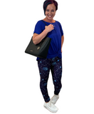 WOMAN WEARING ONE SIZE GALAXY LEGGINGS