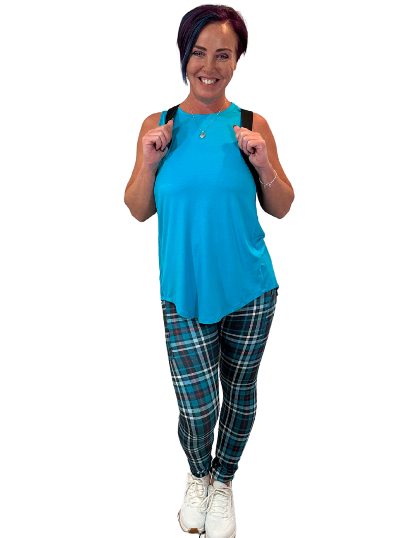 WOMAN WEARING TEAL PLAID LEGGINGS