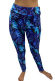 Woman wearing curvy tropical leggings