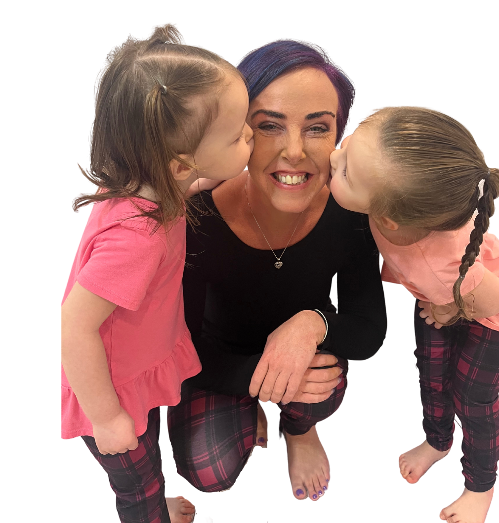 Mom and toddler wearing matching purple plaid leggings