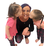 Mom and toddler wearing matching purple plaid leggings