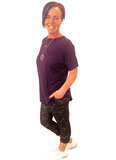 WOMAN WEARING ONE SIZE BUTTERFLY CAPRIS