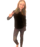 GIRL WEARING BUTTERFLY LEGGINGS
