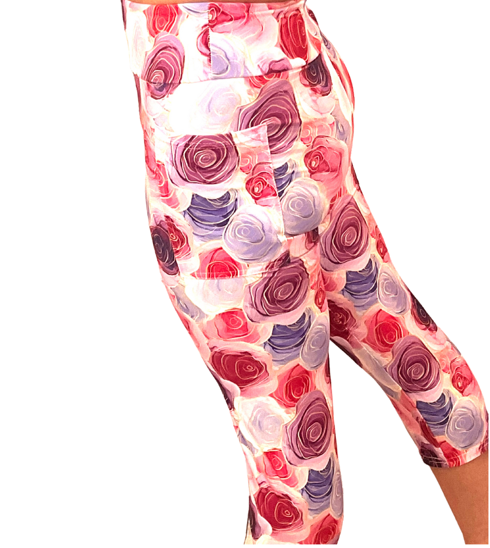 WOMAN WEARING EXTRA CURVY PINK AND WHITE CAPRIS