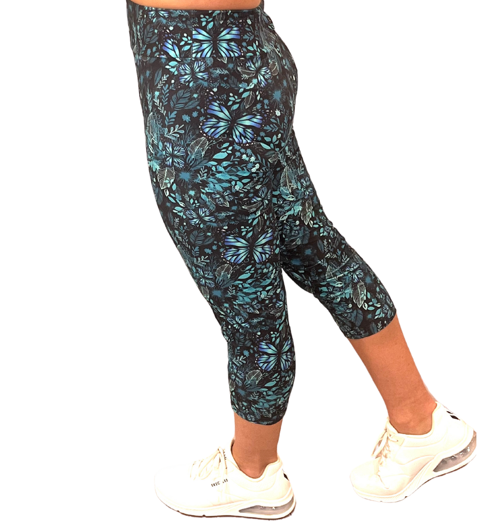 WOMAN WEARING ONE SIZE TEAL CAPRIS