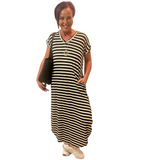 WOMAN WEARING A BLACK STRIPED MAXI DRESS