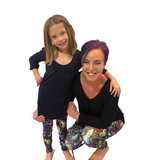 MOM AND DAUGHTER WEARING MATCHING DISNEY LEGGINGS