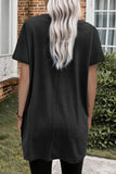 WOMAN WEARING A PLUS SIZE BLACK TUNIC WITH LEGGINGS