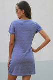 WOMAN WEARING A SHORT SLEEVE BLUE DRESS