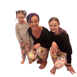 MOM AND DAUGHTER WEARING MATCHING DISNEY LEGGINGS