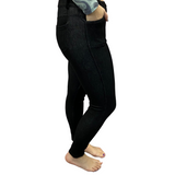 Woman wearing black jeggings with pockets