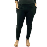 Woman wearing black yoga band leggings with pockets