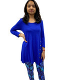 Woman wearing one size blue tropical leggings