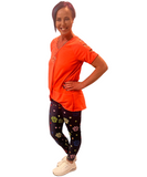 WOMAN WEARING CORAL CUTOUT SHOULDER SHIRT