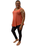 WOMAN WEARING PLUS SIZE CORAL SLEEVELESS SHIRT