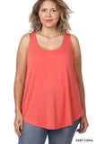 WOMAN WEARING A CORAL TANK TOP AND LEGGINGS