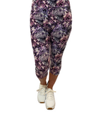 WOMAN WEARING CURVY PURPLE SKULL CAPRIS