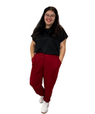 WOMAN WEARING CURVY BURGUNDY JOGGERS