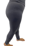 Woman wearing extra plus black leggings