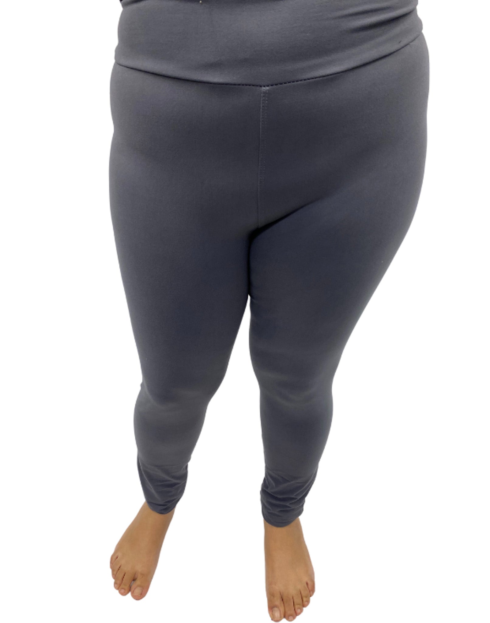 Woman wearing plus size black leggings