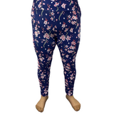 Woman wearing plus size navy floral leggings